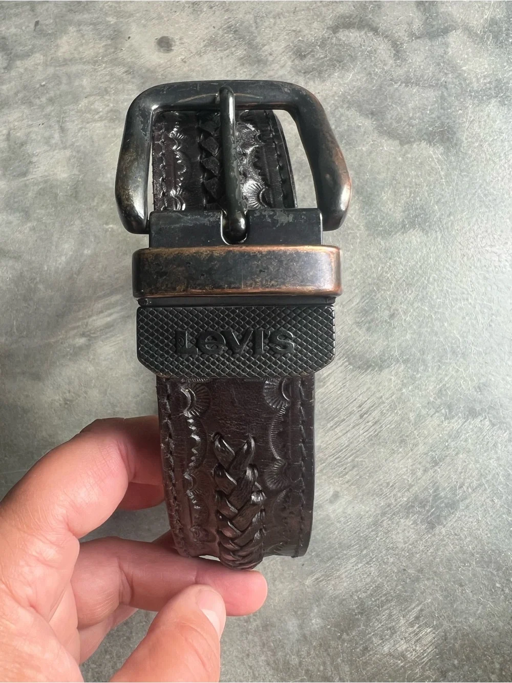 Vintage Levi's black tooled leather western belt with rotating harness buckle
